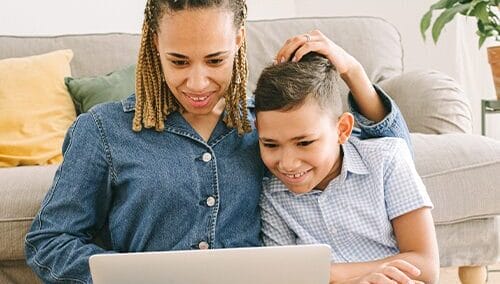 Mother and son with a laptop image