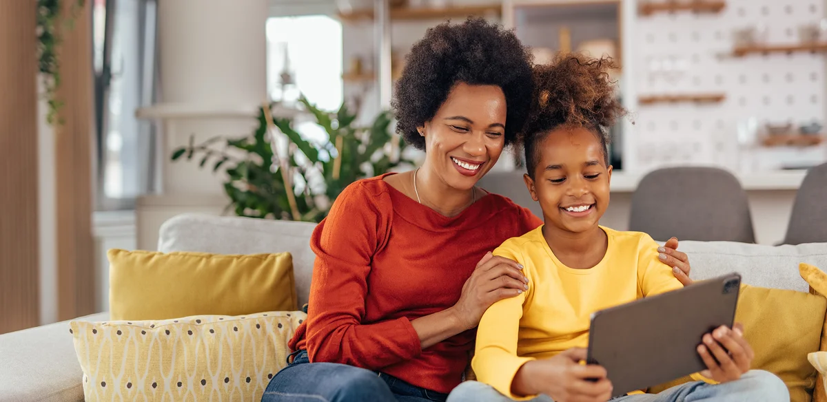 girl smiling with her mom